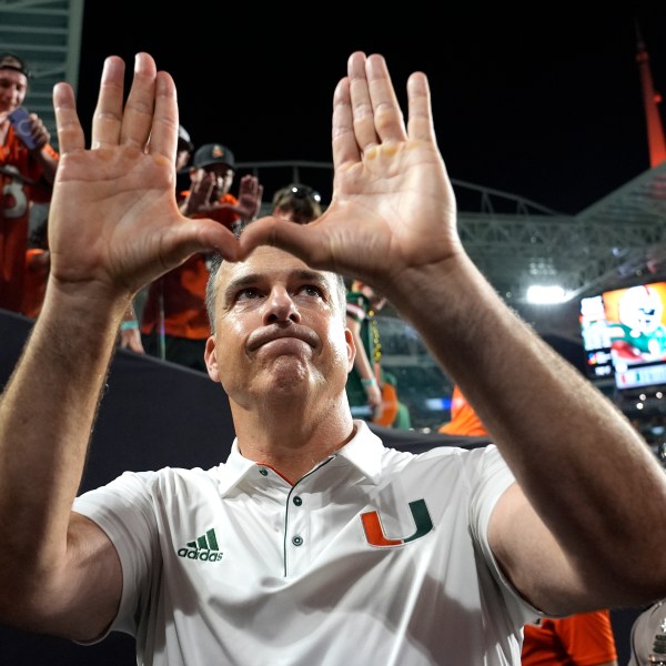 Miami head coach Mario Cristobal acknowledges the crowd after an NCAA college football game against Florida State, Saturday, Oct. 26, 2024, in Miami Gardens, Fla. (AP Photo/Lynne Sladky)