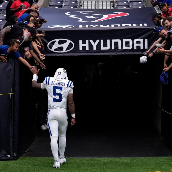 Indianapolis Colts quarterback Anthony Richardson walks off the field after an NFL football game against the Houston Texans, Sunday, Oct. 27, 2024, in Houston. The Texans won 23-20. (AP Photo/Tony Gutierrez)