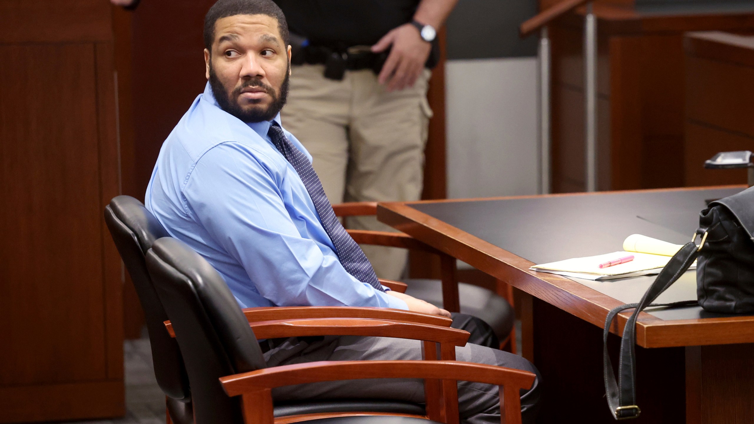 Defendant Julius Trotter, a previously convicted felon who is charged with breaking into a room at a Las Vegas Strip hotel-casino and robbing and killing two Vietnamese tour leaders in June 2018, waits in the courtroom for the verdict in his murder trial, Tuesday, Oct. 29, 2024, at the Regional Justice Center in Las Vegas. (K.M. Cannon/Las Vegas Review-Journal via AP)