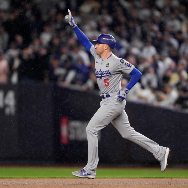 Los Angeles Dodgers' Freddie Freeman celebrates his two-run home run against the New York Yankees during the first inning in Game 4 of the baseball World Series, Tuesday, Oct. 29, 2024, in New York. (AP Photo/Ashley Landis)