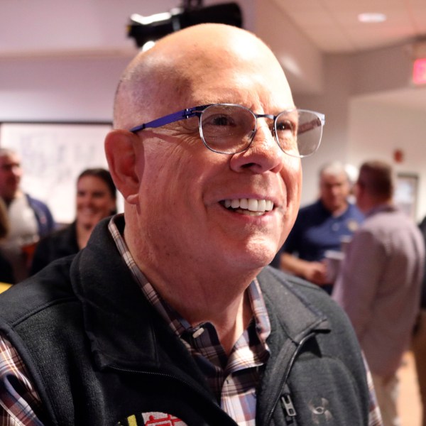 Republican former Gov. Larry Hogan, who is running for U.S. Senate, talks to reporters after a campaign stop with supporters in Millersville, Md., Thursday, Oct. 24, 2024. (AP Photo/Brian Witte)