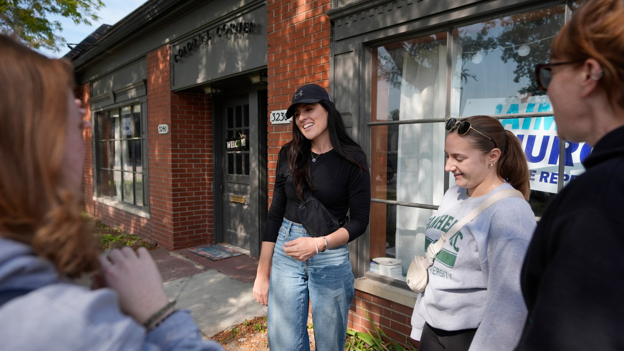 Democratic state Rep. Jaime Churches meets with volunteers, Friday, Oct. 11, 2024, in Trenton, Mich. (AP Photo/Carlos Osorio)