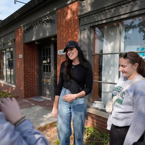 Democratic state Rep. Jaime Churches meets with volunteers, Friday, Oct. 11, 2024, in Trenton, Mich. (AP Photo/Carlos Osorio)