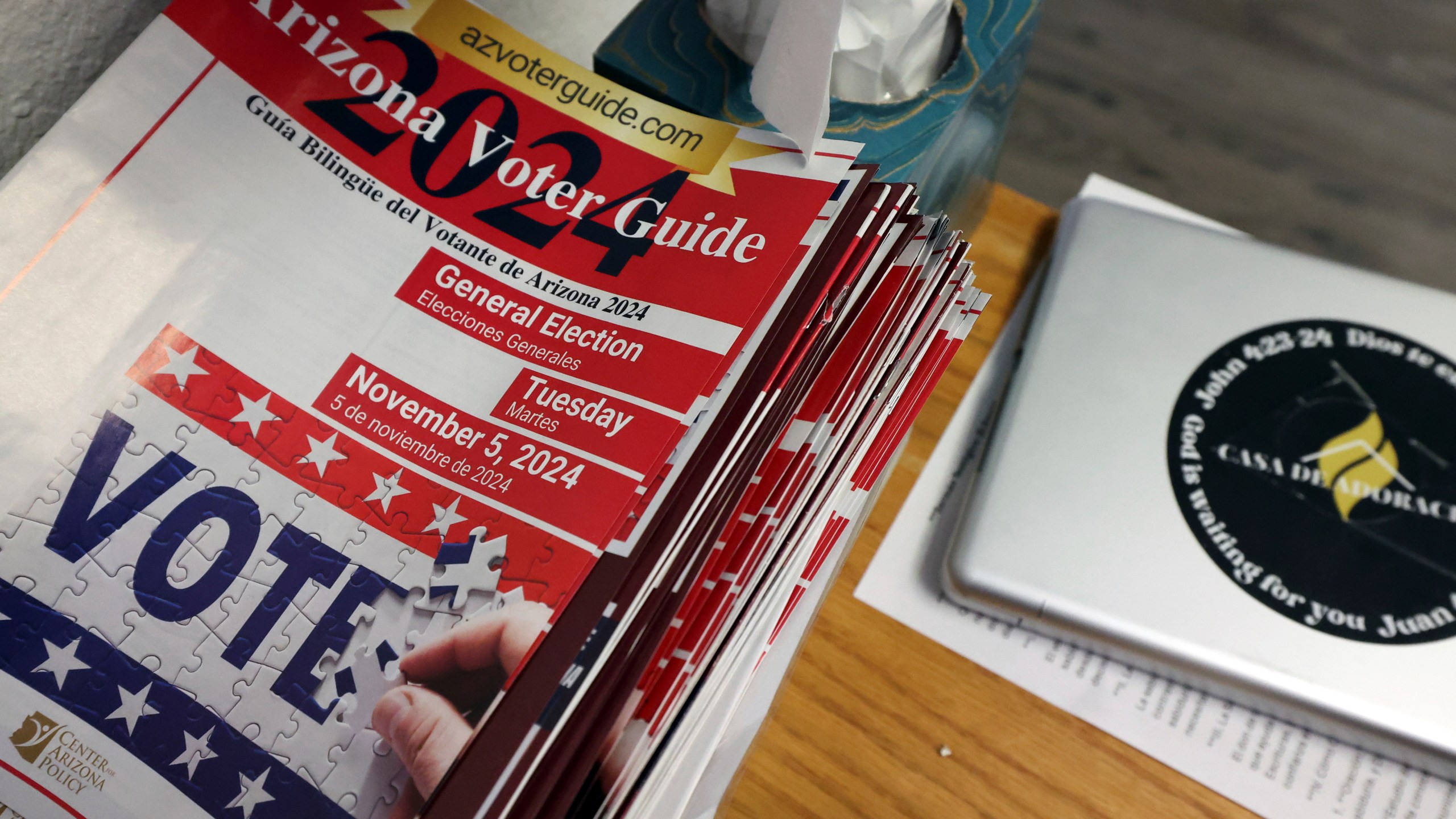 A 2024 Arizona Voter Guide is seen at Casa de Adoracion, Sunday, Oct. 27, 2024 in Phoenix. (AP Photo/Chris Coduto)