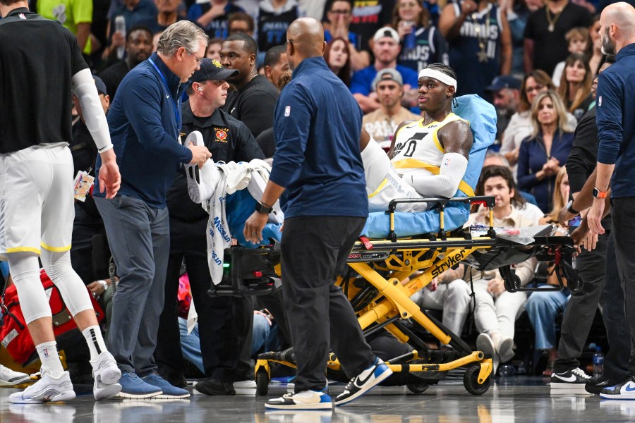 Utah Jazz forward Taylor Hendricks (0) is wheeled off by paramedics after sustaining an injury in the second half during an NBA basketball game against the Dallas Mavericks, Monday, Oct. 28, 2024, in Dallas. (AP Photo/Albert Pena)