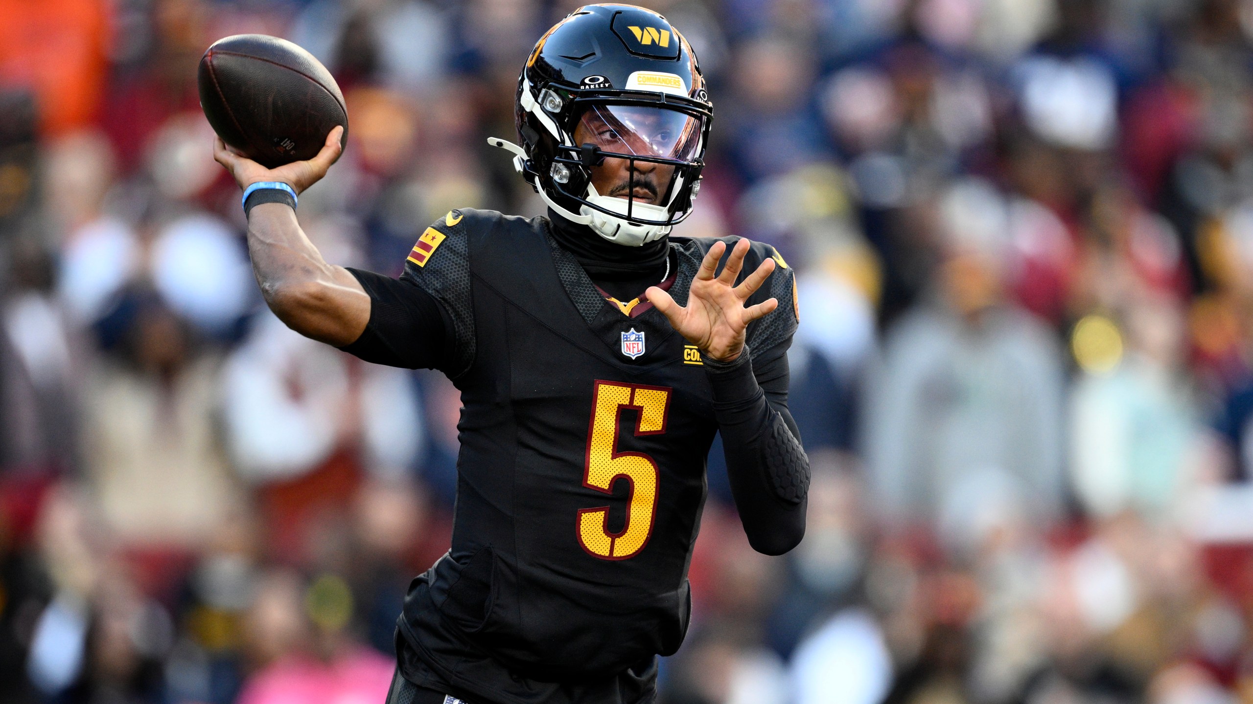 Washington Commanders quarterback Jayden Daniels passes against the Chicago Bears in the first half of an NFL football game Sunday, Oct. 27, 2024, in Landover, Md. (AP Photo/Nick Wass)