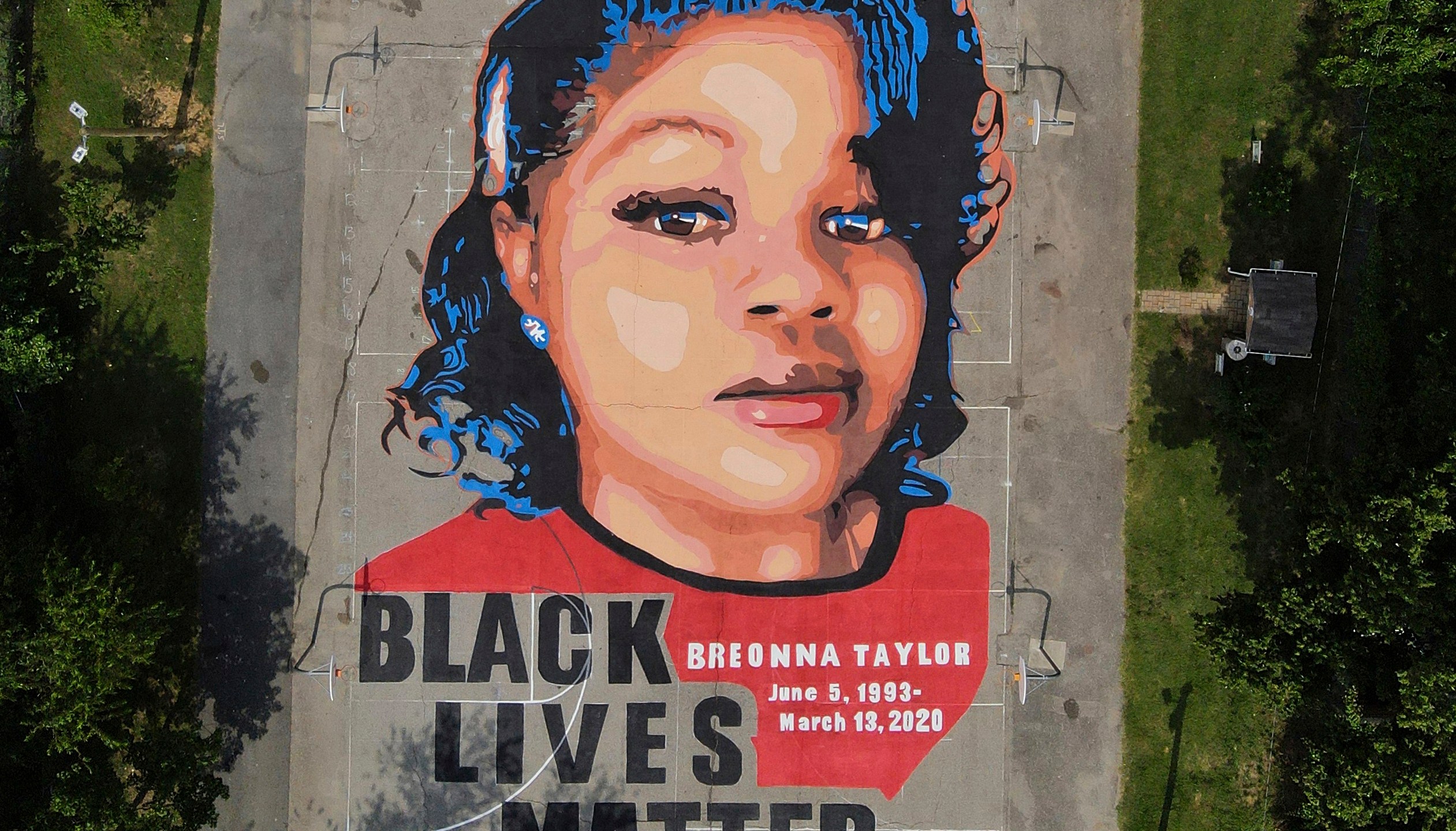 FILE - A ground mural depicting a portrait of Breonna Taylor is seen at Chambers Park in Annapolis, Md., July 6, 2020. (AP Photo/Julio Cortez, File)