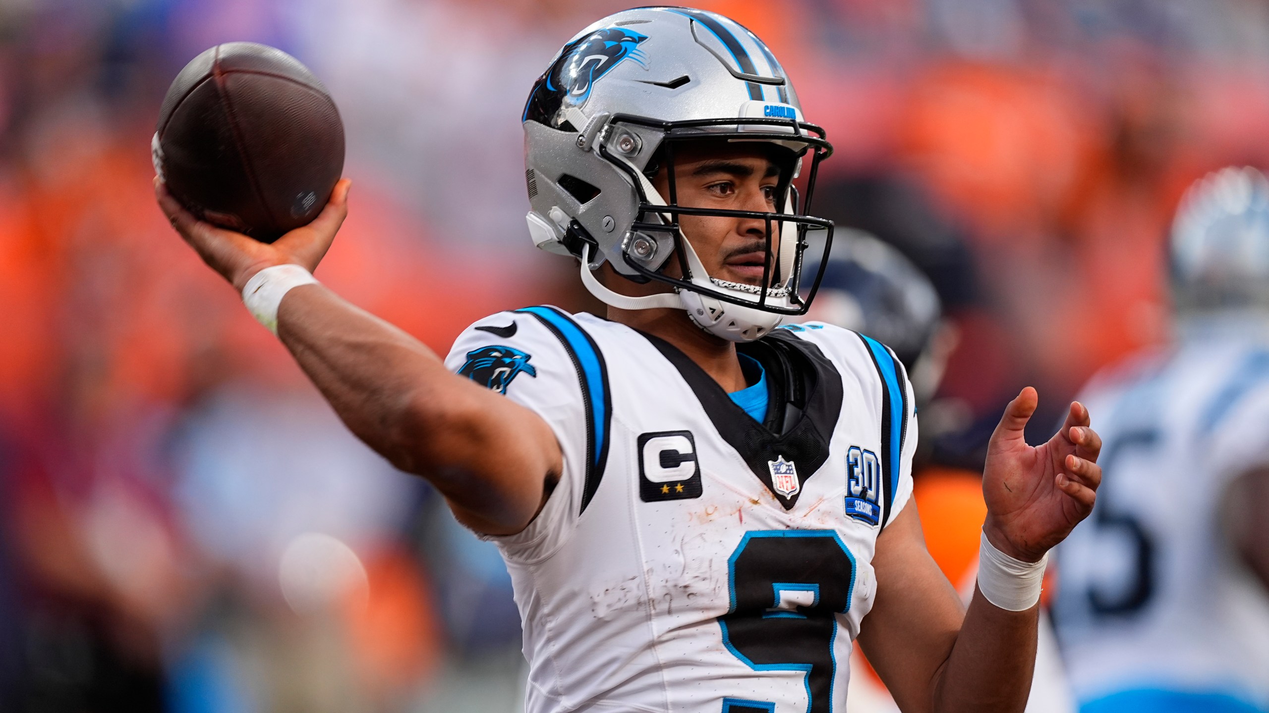 Carolina Panthers quarterback Bryce Young looks to throw a pass late in the second half of an NFL football game against the Denver Broncos, Sunday, Oct. 27, 2024, in Denver. (AP Photo/David Zalubowski)