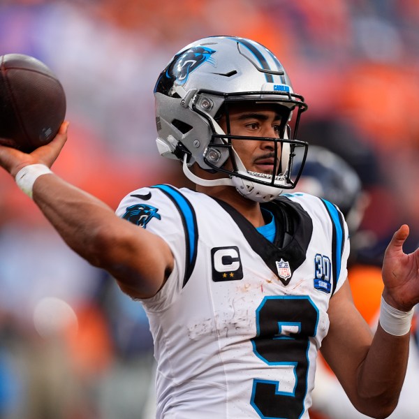 Carolina Panthers quarterback Bryce Young looks to throw a pass late in the second half of an NFL football game against the Denver Broncos, Sunday, Oct. 27, 2024, in Denver. (AP Photo/David Zalubowski)