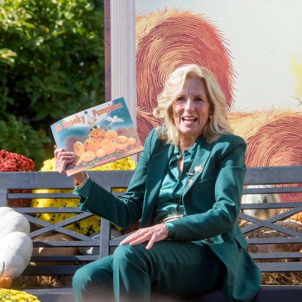 First lady Jill Biden participates in a "Hallo-READ" story-time session by reading the book "10 Spooky Pumpkins" by Gris Grimly to children on the South Lawn of the White House in Washington, Wednesday, Oct. 30, 2024. (AP Photo/Rod Lamkey, Jr.)