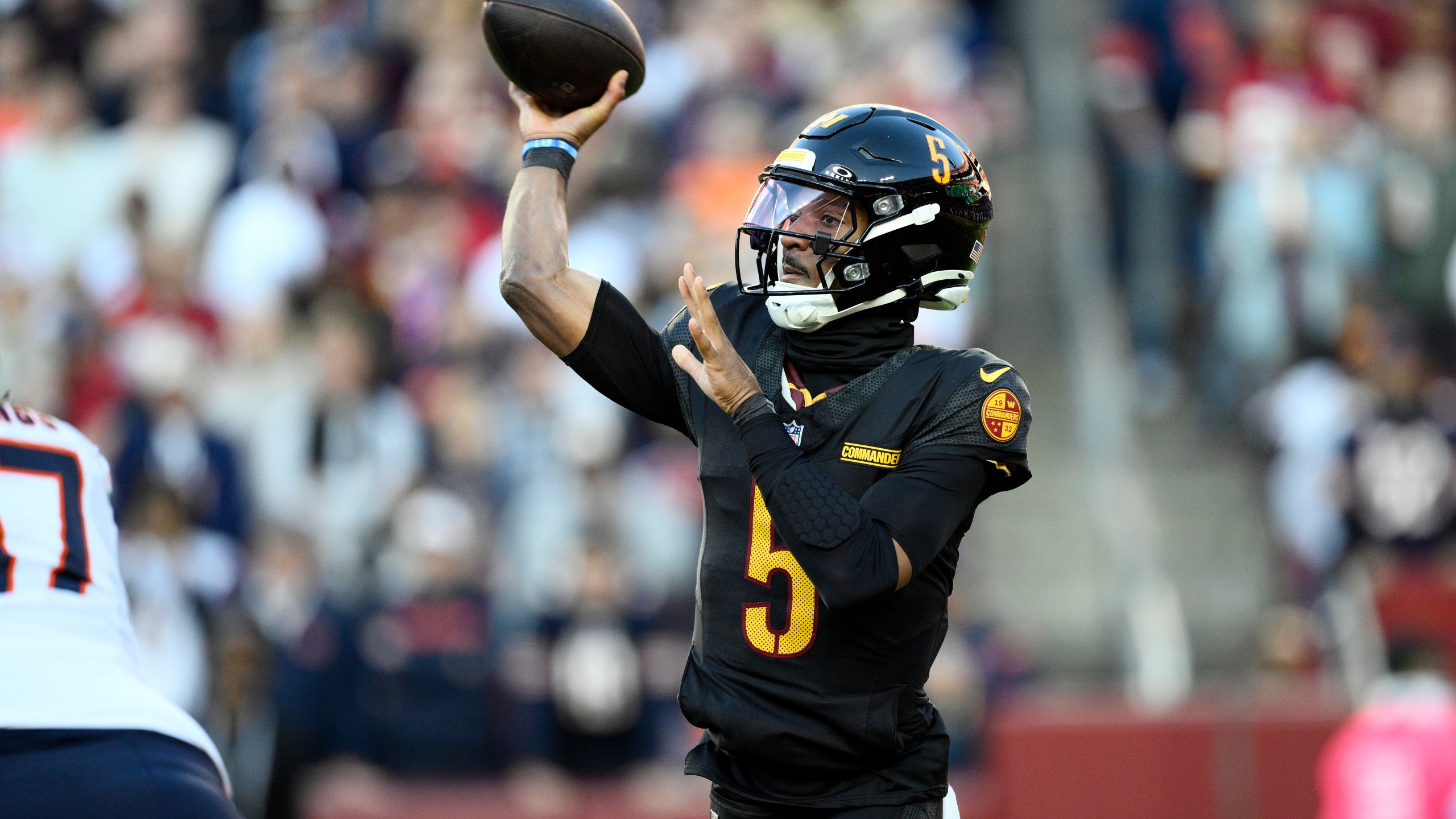 Washington Commanders quarterback Jayden Daniels (5) passes against the Chicago Bears in the first half of an NFL football game Sunday, Oct. 27, 2024, in Landover, Md. (AP Photo/Nick Wass)