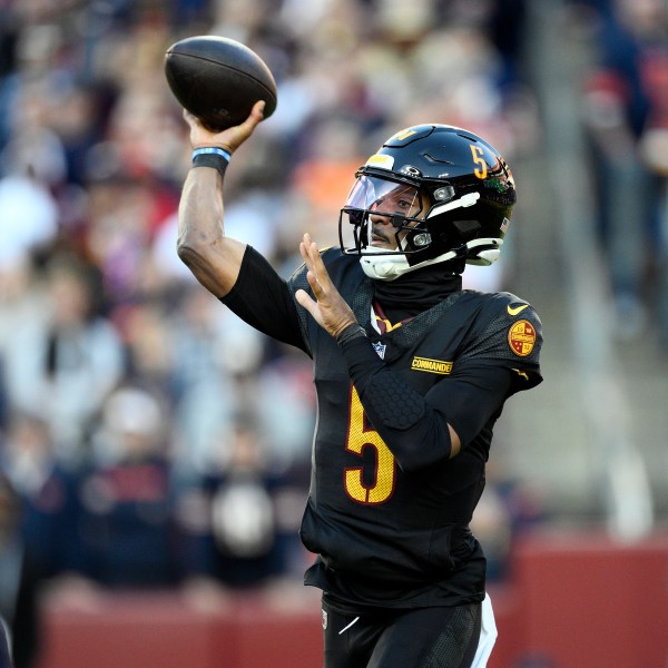 Washington Commanders quarterback Jayden Daniels (5) passes against the Chicago Bears in the first half of an NFL football game Sunday, Oct. 27, 2024, in Landover, Md. (AP Photo/Nick Wass)