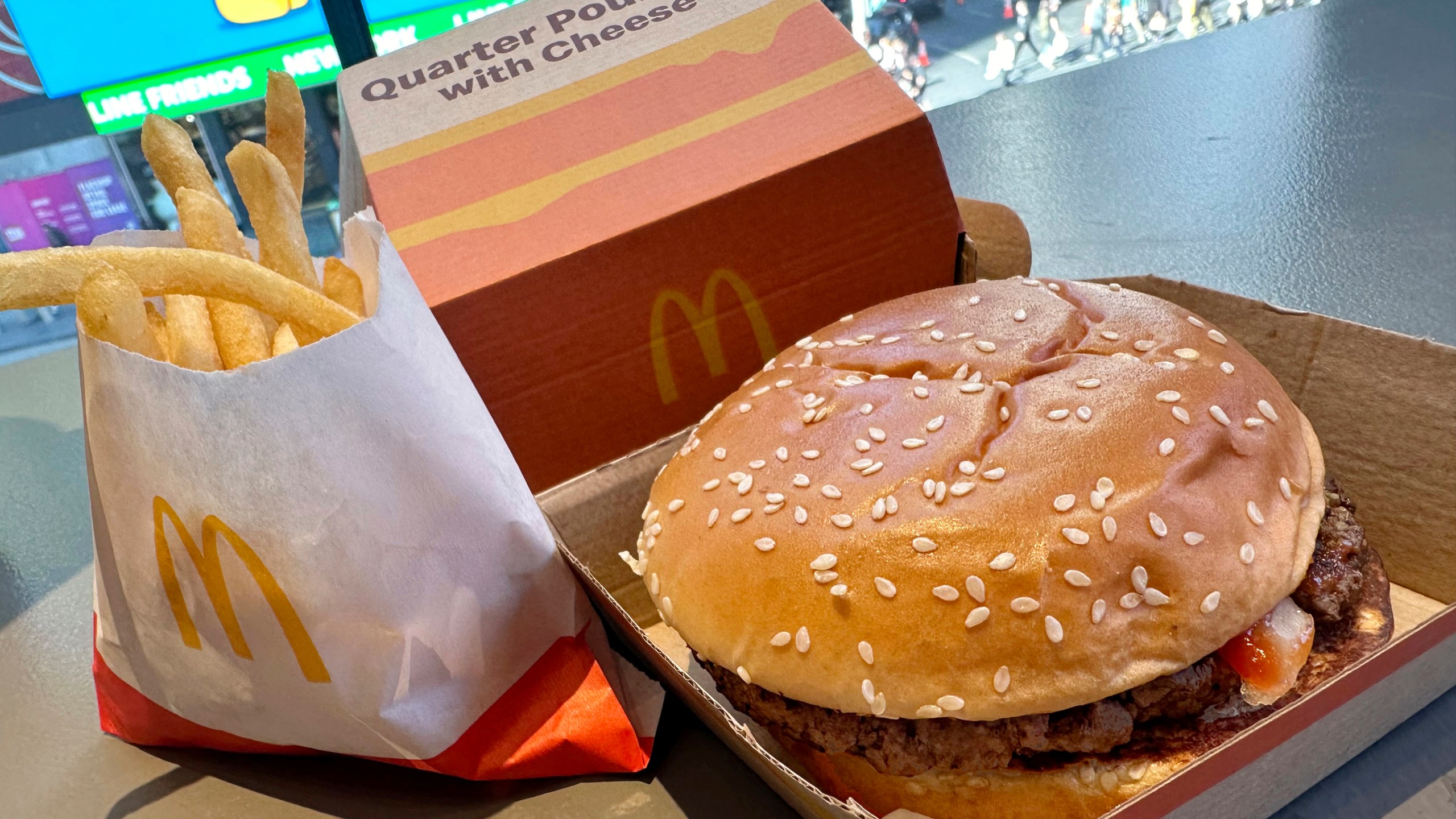 A McDonald's Quarter Pounder hamburger and fries are shown in this photograph, in New York's Times Square, Wednesday, Oct. 23, 2024. (AP Photo/Richard Drew)