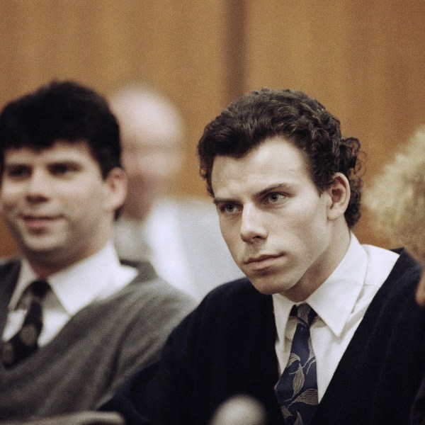 FILE - Lyle, left, and Erik Menendez sit with defense attorney Leslie Abramson, right, in Beverly Hills Municipal Court during a hearing, Nov. 26, 1990. (AP Photo/Nick Ut, File)