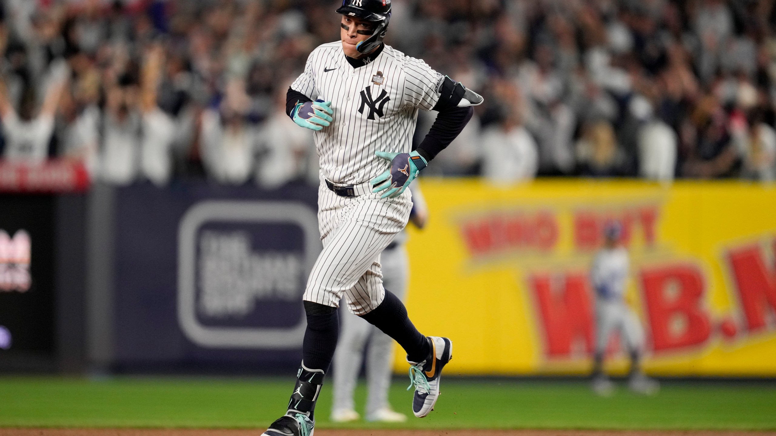 New York Yankees' Aaron Judge rounds the bases after a two-run home run against the Los Angeles Dodgers during the first inning in Game 5 of the baseball World Series, Wednesday, Oct. 30, 2024, in New York. (AP Photo/Ashley Landis)