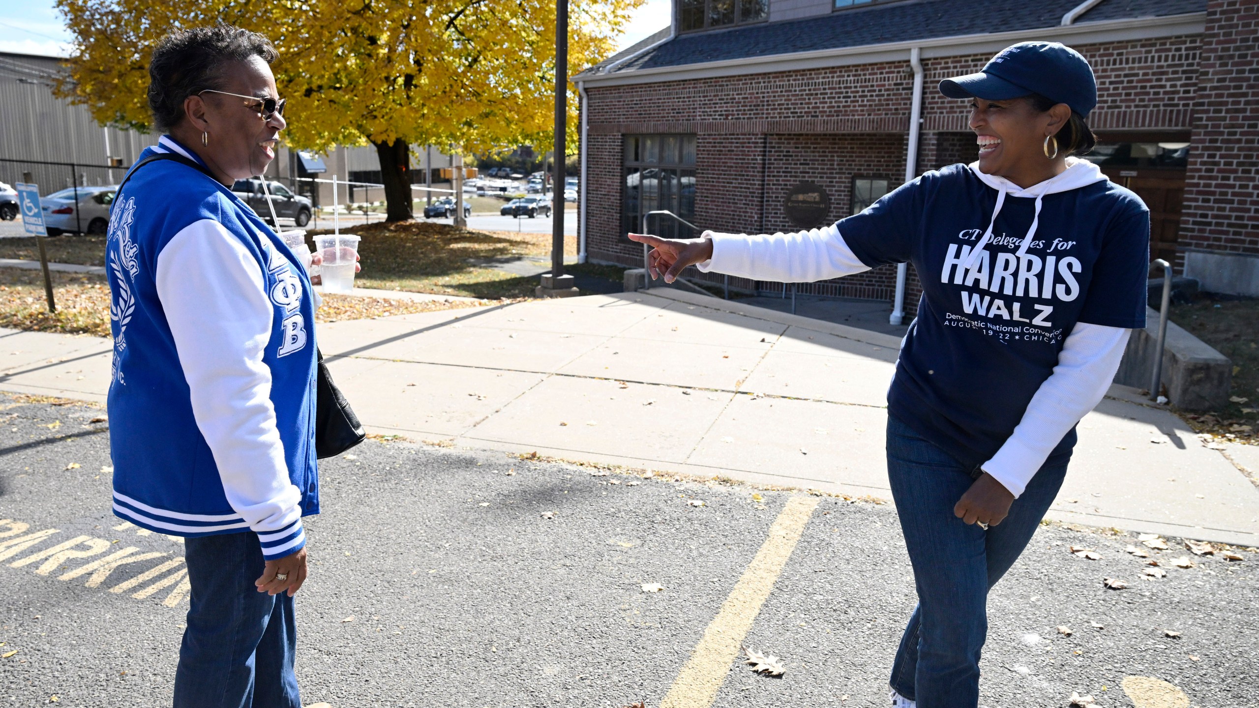 Linda Chapman of Waterbury, left, a member of the Zeta Phi Beta, talks with U.S. Rep. Jahana Hayes, D-Conn. at a Souls to the Polls voting rally at Grace Baptist Church Saturday, Oct. 26, 2024, in Waterbury, Conn. (AP Photo/Jessica Hill)