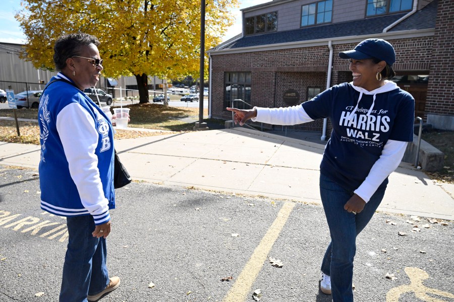 Linda Chapman of Waterbury, left, a member of the Zeta Phi Beta, talks with U.S. Rep. Jahana Hayes, D-Conn. at a Souls to the Polls voting rally at Grace Baptist Church Saturday, Oct. 26, 2024, in Waterbury, Conn. (AP Photo/Jessica Hill)