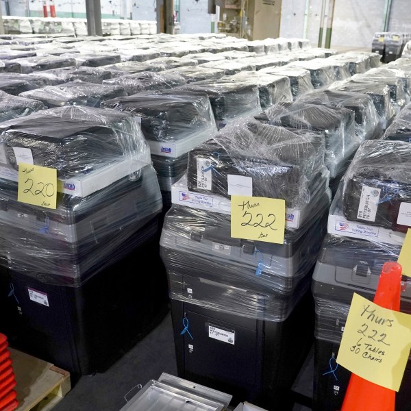 Voting machines are prepared for use on Election Day at the Allegheny County Elections Division warehouse, Wednesday, Oct. 30, 2024, in Pittsburgh. (AP Photo/Matt Freed)