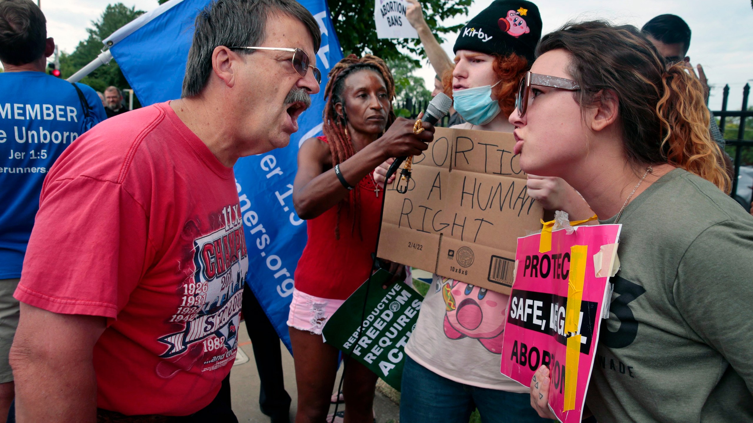 FILE - Steve Sallwasser, of Arnold, debates Brittany Nickens, of Maplewood, during competing rallies outside Planned Parenthood of Missouri, following the U.S. Supreme Court decision to overturn Roe v. Wade, June 24, 2022, in St. Louis. (Robert Cohen/St. Louis Post-Dispatch via AP, File)