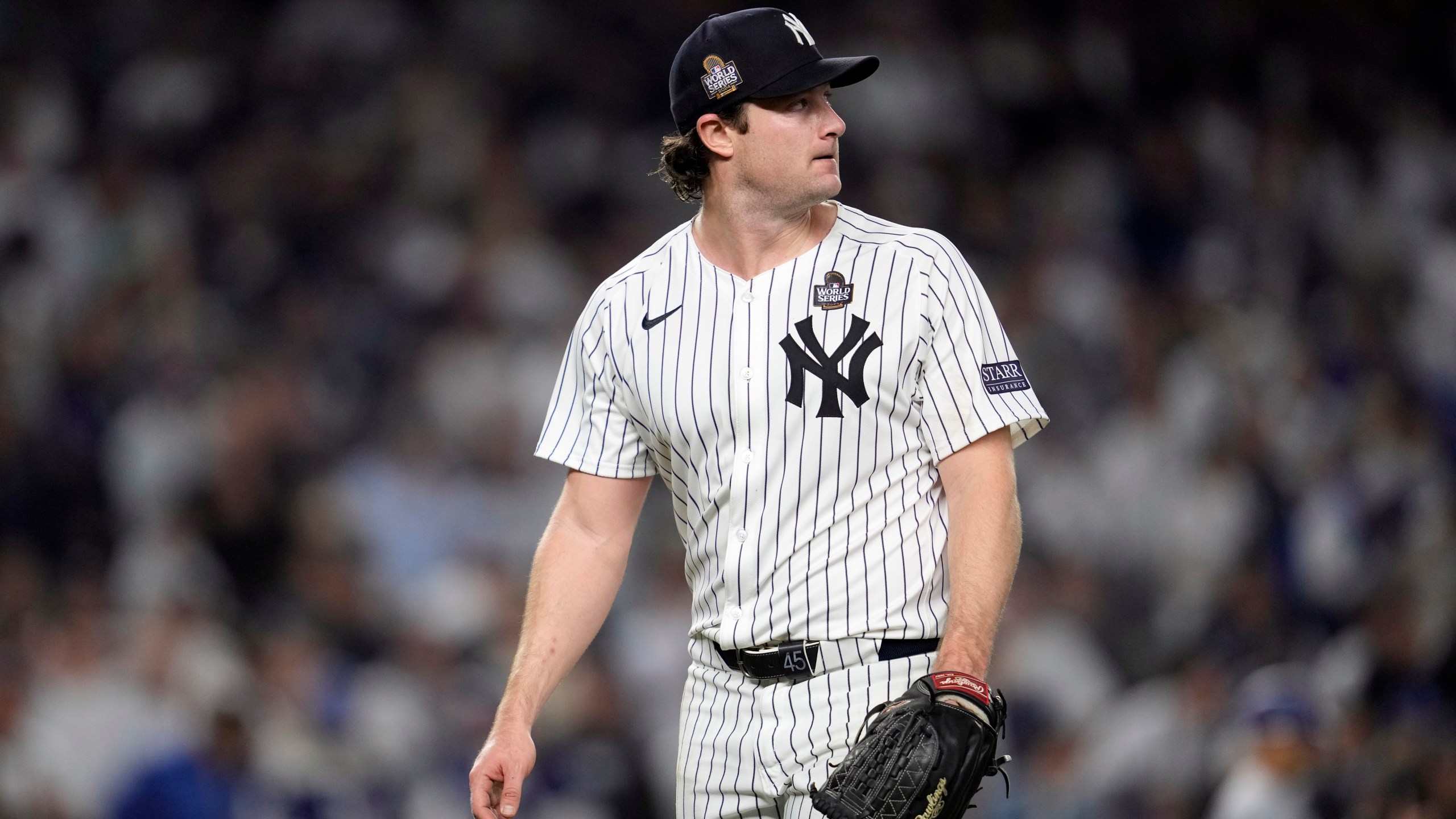 New York Yankees starting pitcher Gerrit Cole looks back toward the scoreboard after throwing against the Los Angeles Dodgers during the fifth inning in Game 5 of the baseball World Series, Wednesday, Oct. 30, 2024, in New York. (AP Photo/Godofredo A. Vásquez)