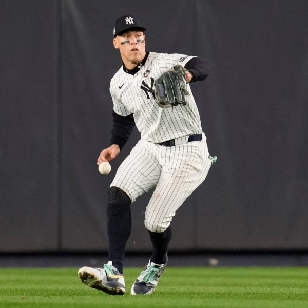 New York Yankees center fielder Aaron Judge makes error fielding on a ball hit by Los Angeles Dodgers' Tommy Edman during the fifth inning in Game 5 of the baseball World Series, Wednesday, Oct. 30, 2024, in New York. (AP Photo/Ashley Landis)