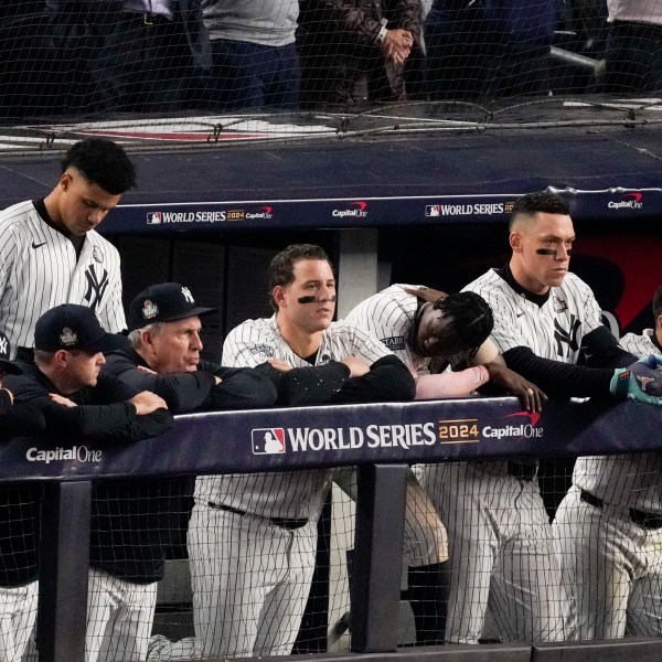 The New York Yankees watch during their loss against the Los Angeles Dodgers in Game 5 of the baseball World Series, Wednesday, Oct. 30, 2024, in New York. (AP Photo/Frank Franklin II)