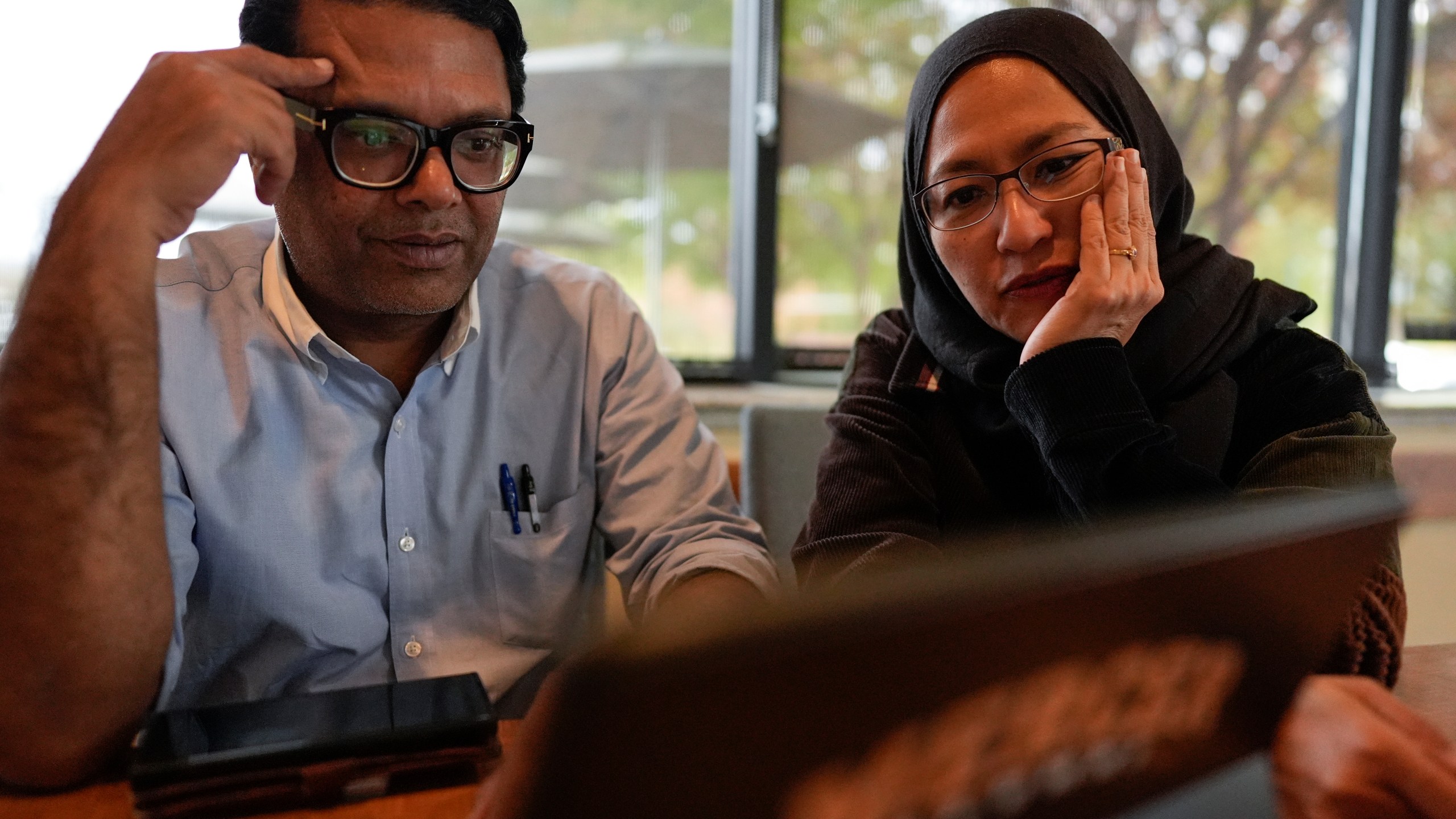 Soraya Burhani, right, works with Georgia Rep. Farooq Mughal, Wednesday, Oct. 30, 2024, in Buford, Ga. (AP Photo/Mike Stewart)