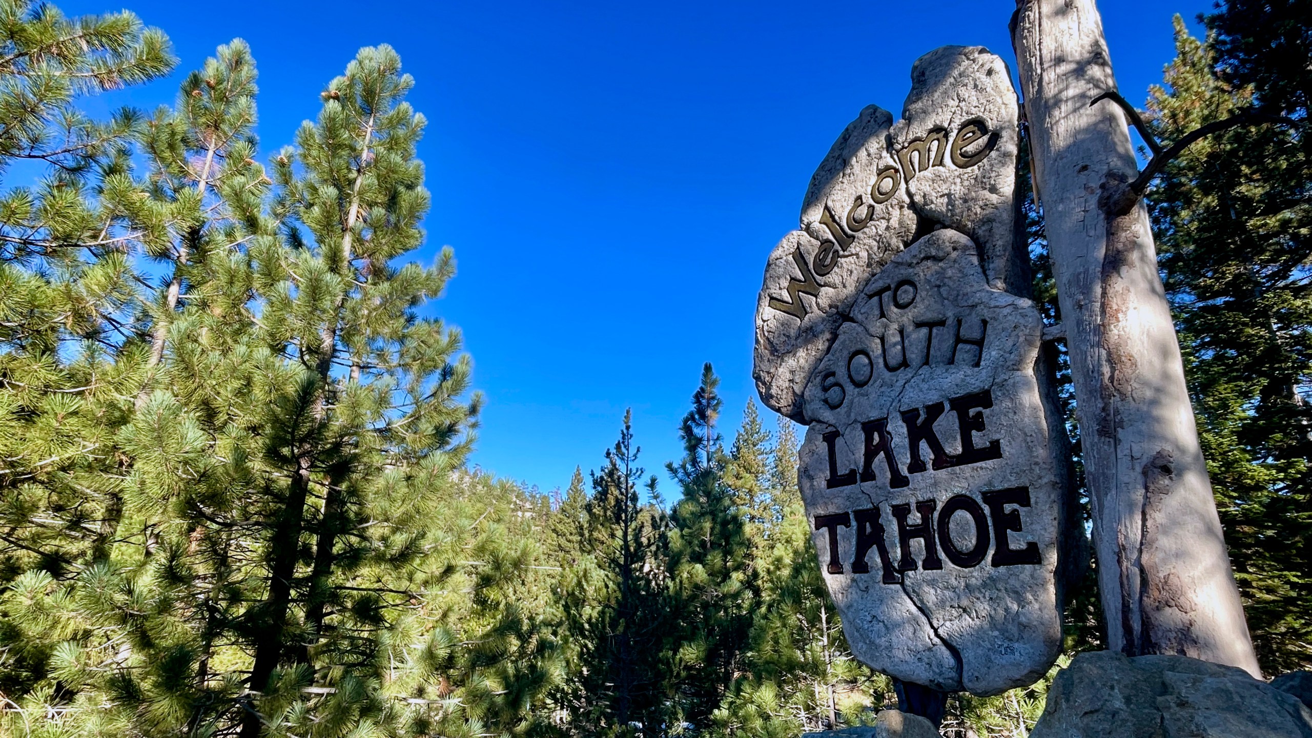 A sign welcomes motorists to South Lake Tahoe, Calif. on Friday, Oct. 18, 2024, where voters will decide whether to approve Measure N, which will mandate a tax to homeowners who leave their homes vacant for more than half the year. (AP Photo/Haven Daley)