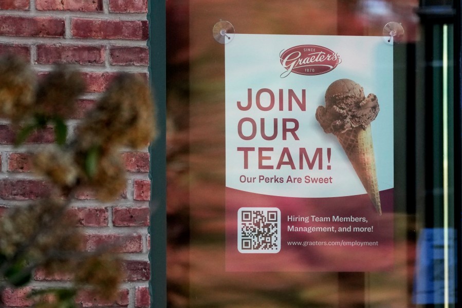 A sign soliciting job applicants is displayed at an ice cream shop in Northbrook, Ill., Sunday, Oct. 27, 2024. (AP Photo/Nam Y. Huh)