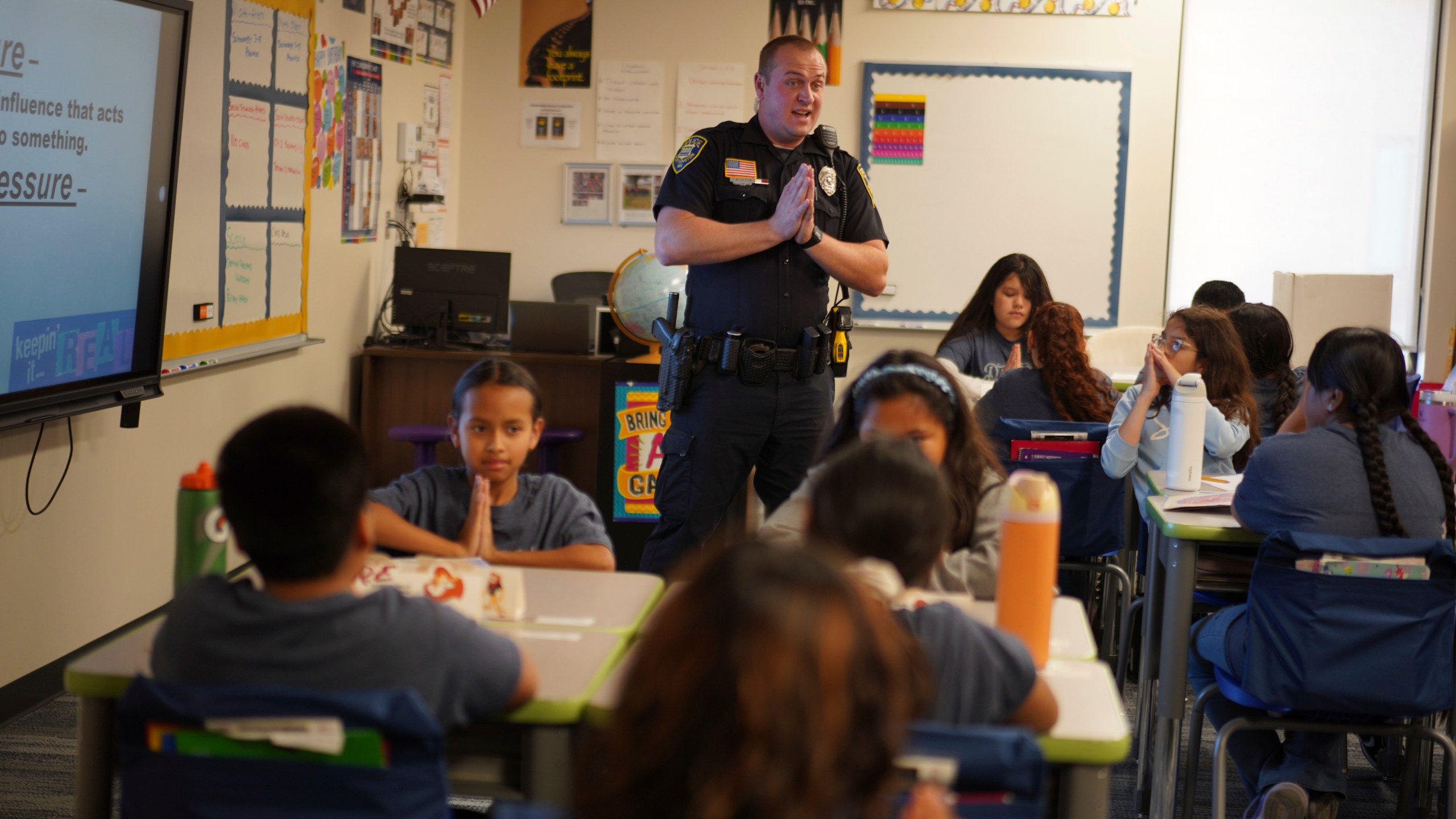 Tyler Olson, a Worthington police officer who also serves as a school resource officer, leads a D.A.R.E. class at the 700-student intermediate school in Worthington, Minn., on Tuesday, Oct. 22, 2024. (AP Photo/Jessie Wardarski)