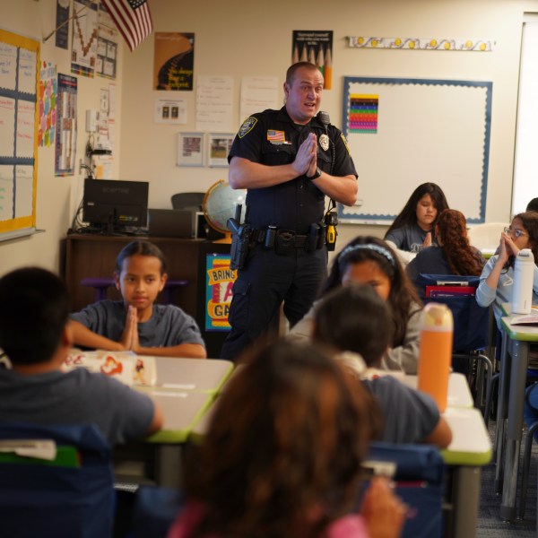 Tyler Olson, a Worthington police officer who also serves as a school resource officer, leads a D.A.R.E. class at the 700-student intermediate school in Worthington, Minn., on Tuesday, Oct. 22, 2024. (AP Photo/Jessie Wardarski)