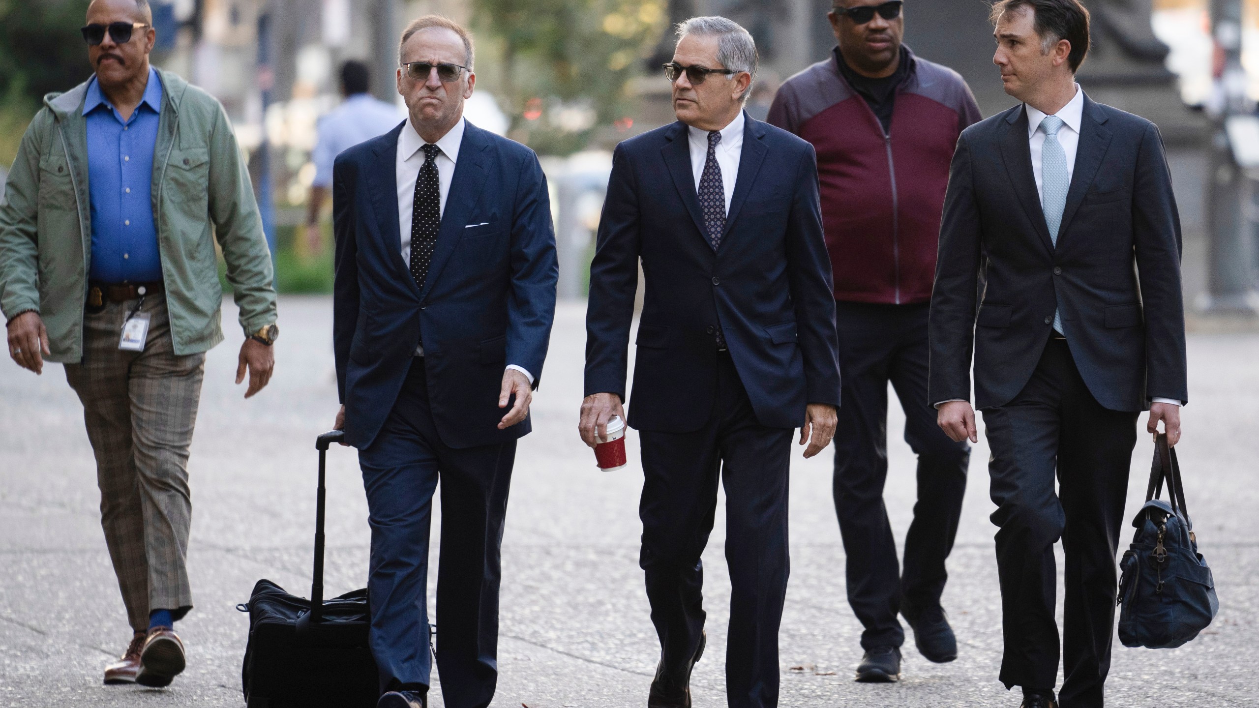 Philadelphia District Attorney Larry Krasner, third from right, arrives for a hearing at a City Hall courtroom, Thursday, Oct. 31, 2024, in Philadelphia. (AP Photo/Matt Rourke)