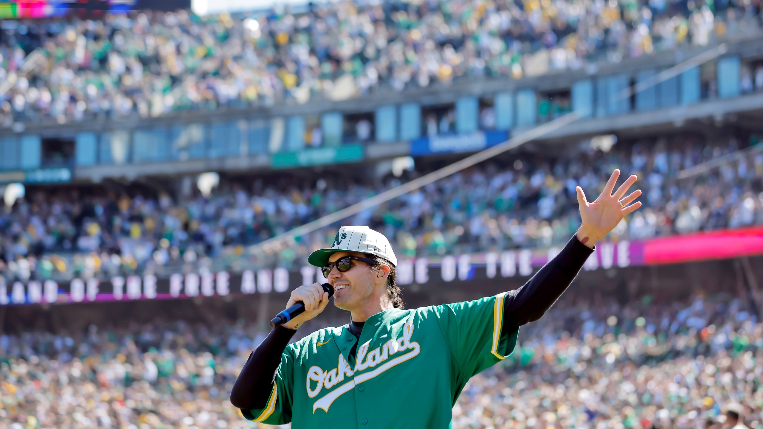 FILE - Former Oakland Athetics pitcher Barry Zito sings the national anthem before the Athletics play the Texas Rangers in Oakland, Calif., Sept. 26, 2024. (Carlos Avila Gonzalez/San Francisco Chronicle via AP, File)