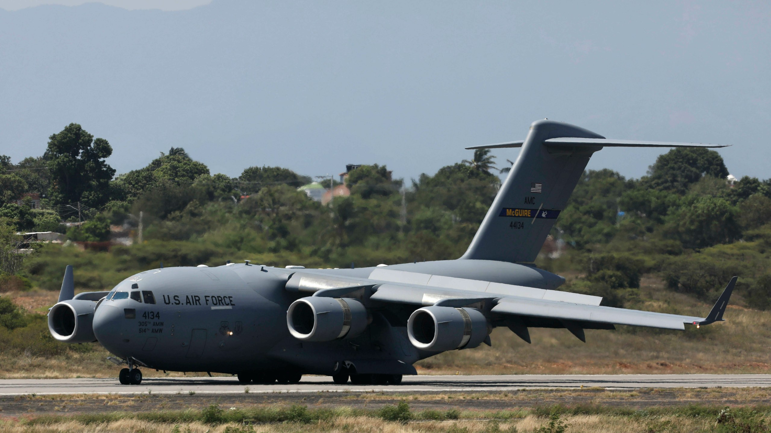 FILE - A United States Air Force C-17 cargo plane loaded with humanitarian aid lands at Camilo Daza airport in Cucuta, Colombia, on Feb. 16, 2019. (AP Photo/Fernando Vergara, File)