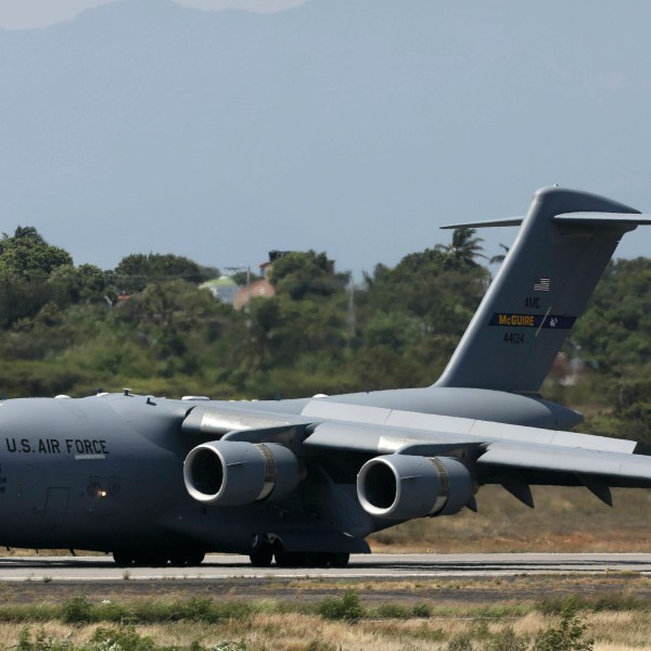 FILE - A United States Air Force C-17 cargo plane loaded with humanitarian aid lands at Camilo Daza airport in Cucuta, Colombia, on Feb. 16, 2019. (AP Photo/Fernando Vergara, File)