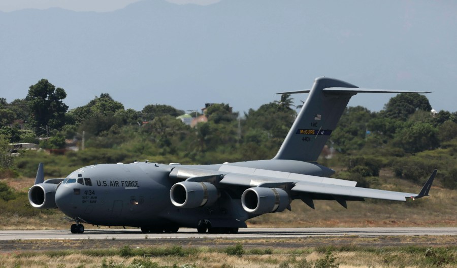 FILE - A United States Air Force C-17 cargo plane loaded with humanitarian aid lands at Camilo Daza airport in Cucuta, Colombia, on Feb. 16, 2019. (AP Photo/Fernando Vergara, File)