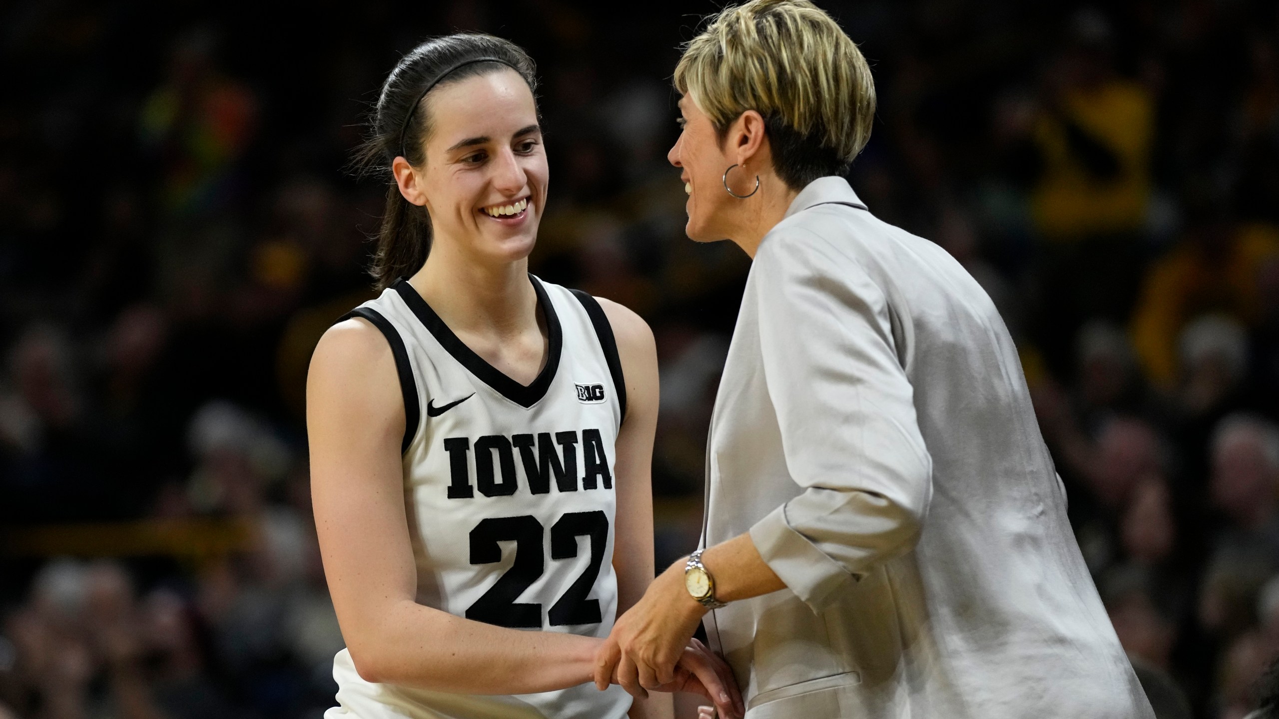 FILE - Iowa guard Caitlin Clark talks with assistant coach Jan Jensen during the second half of an NCAA college basketball game against Drake, Nov. 19, 2023, in Iowa City, Iowa. (AP Photo/Charlie Neibergall, file)