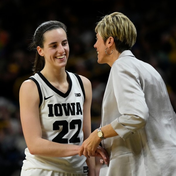 FILE - Iowa guard Caitlin Clark talks with assistant coach Jan Jensen during the second half of an NCAA college basketball game against Drake, Nov. 19, 2023, in Iowa City, Iowa. (AP Photo/Charlie Neibergall, file)