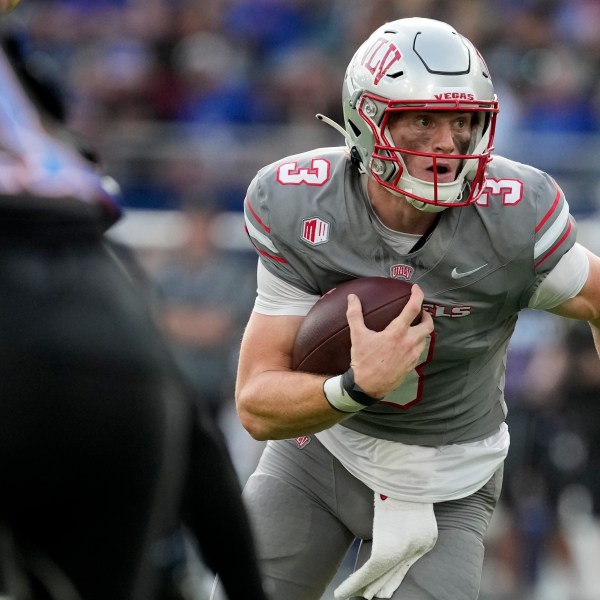 FILE - UNLV quarterback Matthew Sluka runs the ball against Kansas in the first half of an NCAA college football game Friday, Sept. 13, 2024, at Children's Mercy Park in Kansas City, Kan. (AP Photo/Ed Zurga, File)