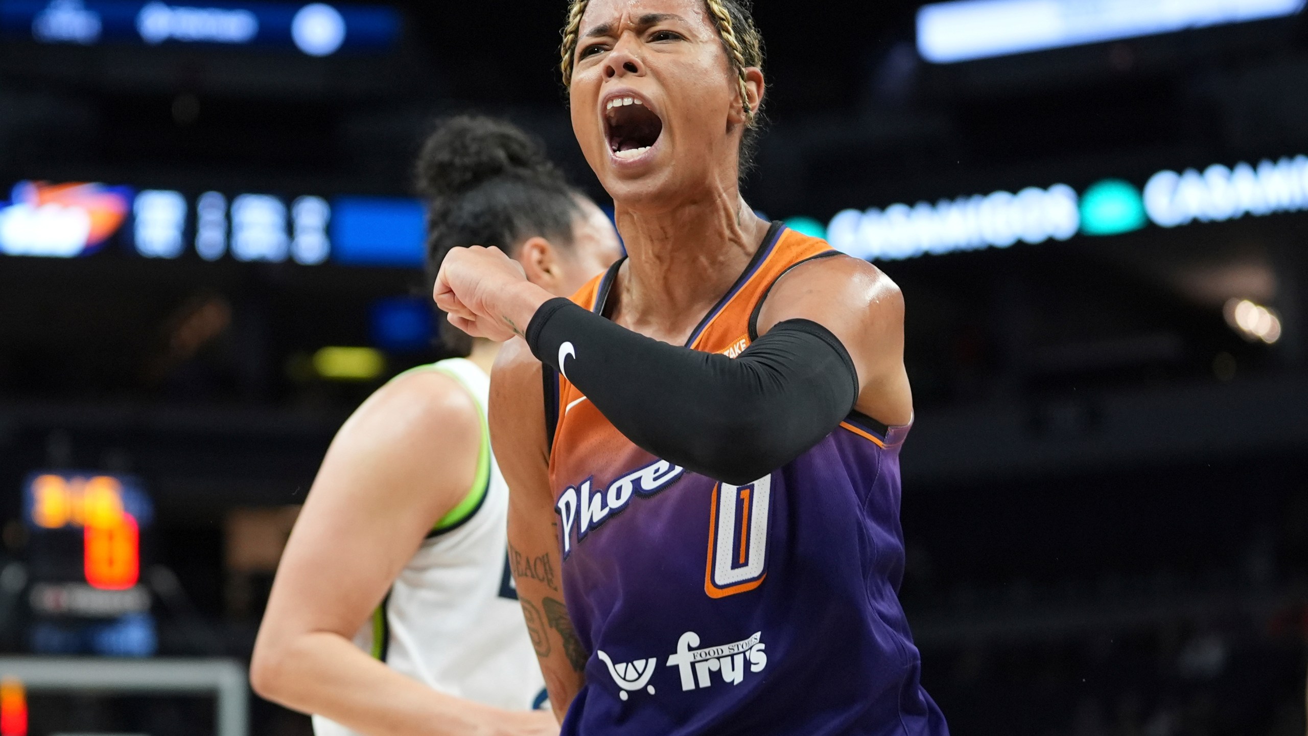 FILE - Phoenix Mercury guard Natasha Cloud (0) celebrates after making a shot while fouled during the first half of a WNBA basketball game against the Minnesota Lynx, Friday, May 31, 2024, in Minneapolis. (AP Photo/Abbie Parr, File)