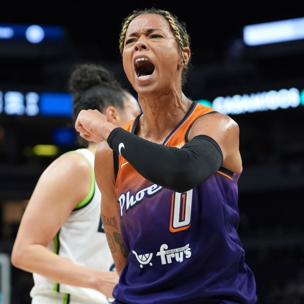 FILE - Phoenix Mercury guard Natasha Cloud (0) celebrates after making a shot while fouled during the first half of a WNBA basketball game against the Minnesota Lynx, Friday, May 31, 2024, in Minneapolis. (AP Photo/Abbie Parr, File)