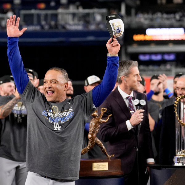 Los Angeles Dodgers manager Dave Roberts celebrates their win against the New York Yankees in Game 5 to win the baseball World Series, Thursday, Oct. 31, 2024, in New York. (AP Photo/Ashley Landis)