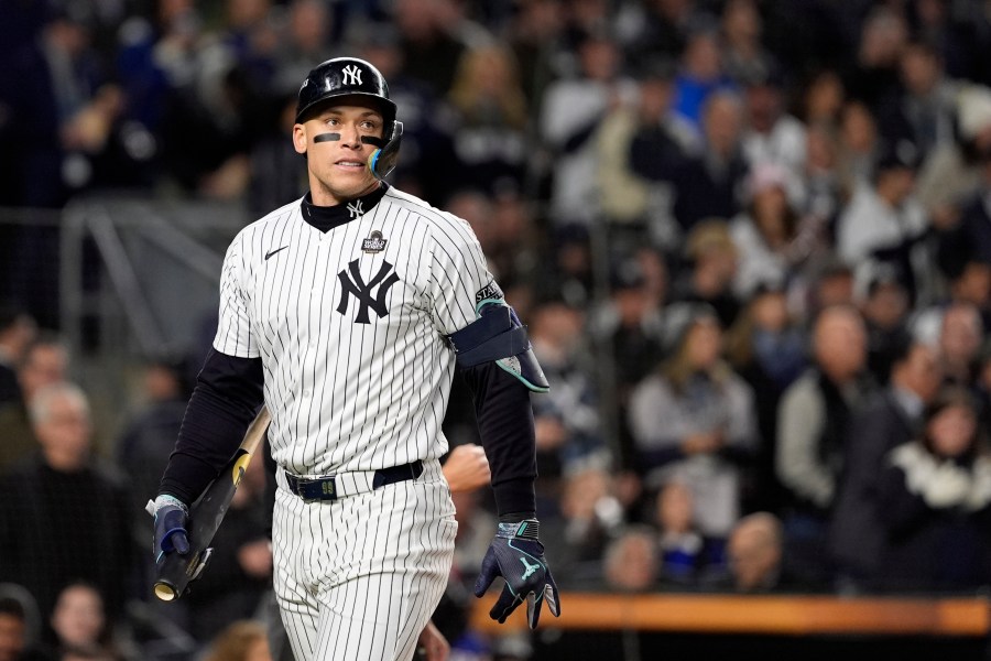 New York Yankees' Aaron Judge walks back to the dugout after striking out against the Los Angeles Dodgers during the first inning in Game 3 of the baseball World Series, Monday, Oct. 28, 2024, in New York. (AP Photo/Godofredo A. Vásquez)