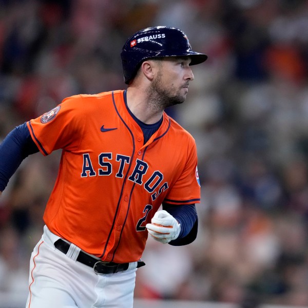 Houston Astros' Alex Bregman sprints to first after hitting for a single against the Detroit Tigers in the second inning of Game 2 of an AL Wild Card Series baseball game Wednesday, Oct. 2, 2024, in Houston. (AP Photo/Kevin M. Cox)