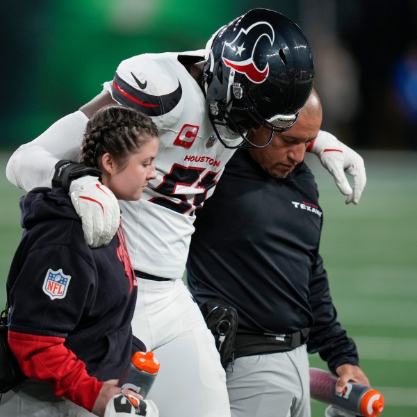 Houston Texans defensive end Will Anderson Jr. (51) is helped off the field after an injury during the first half an NFL football game against the New York Jets, Thursday, Oct. 31, 2024, in East Rutherford, N.J. (AP Photo/Seth Wenig)