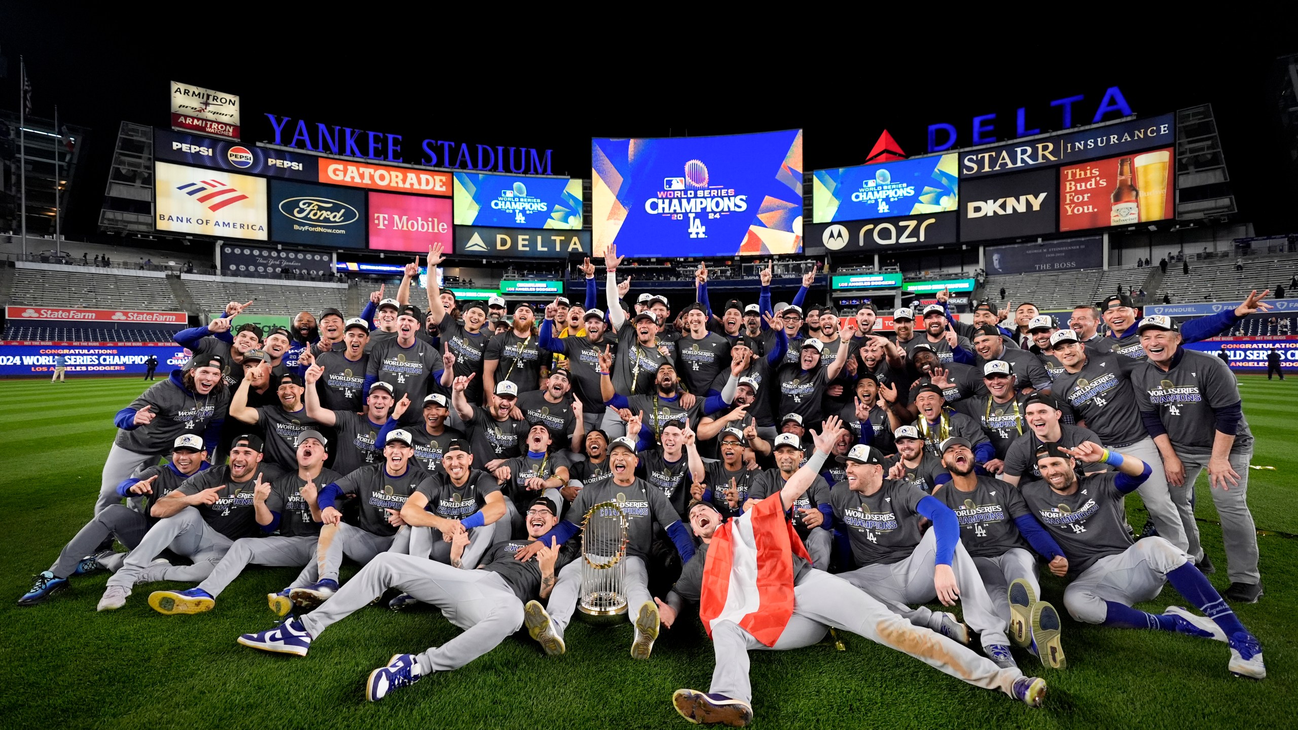 The Los Angeles Dodgers pose for a team picture after their win against the New York Yankees in Game 5 to win the baseball World Series, Thursday, Oct. 31, 2024, in New York. (AP Photo/Ashley Landis)