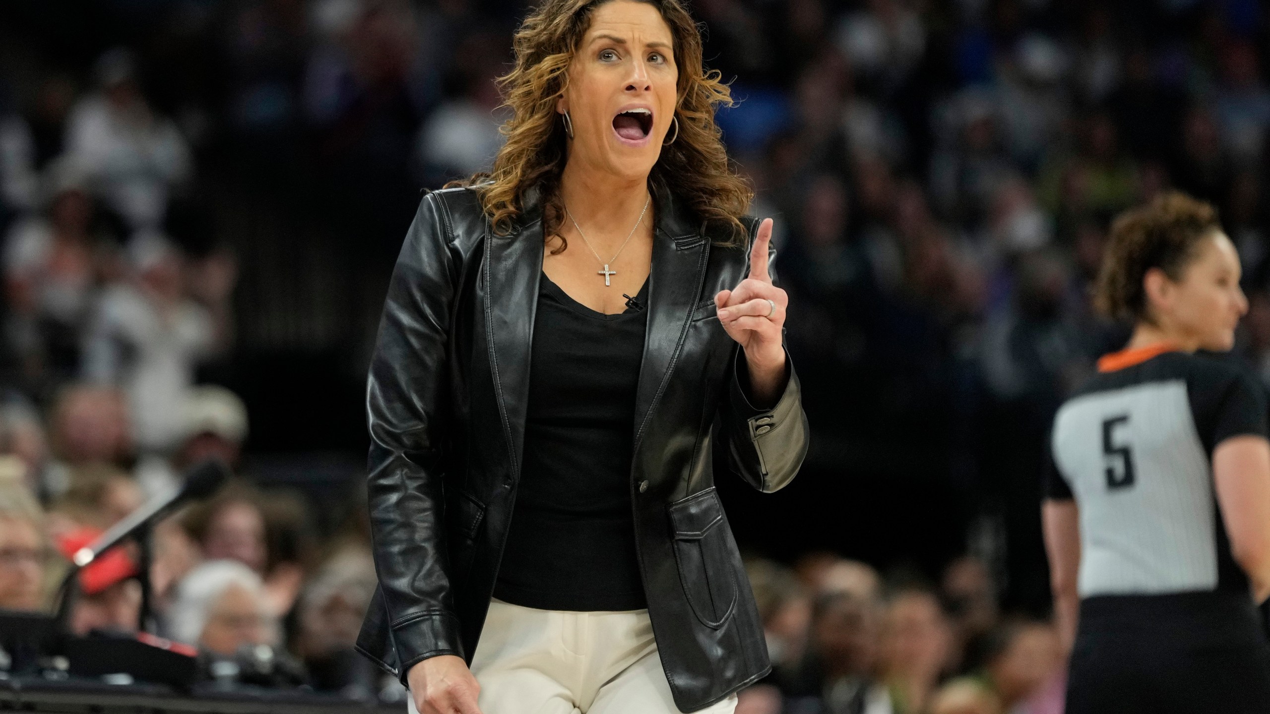 Connecticut Sun head coach Stephanie White reacts after a foul called on the Sun during the first half of Game 5 of a WNBA basketball semifinals against the Minnesota Lynx, Tuesday, Oct. 8, 2024, in Minneapolis. (AP Photo/Abbie Parr)