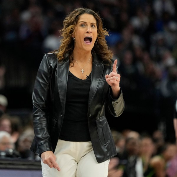 Connecticut Sun head coach Stephanie White reacts after a foul called on the Sun during the first half of Game 5 of a WNBA basketball semifinals against the Minnesota Lynx, Tuesday, Oct. 8, 2024, in Minneapolis. (AP Photo/Abbie Parr)