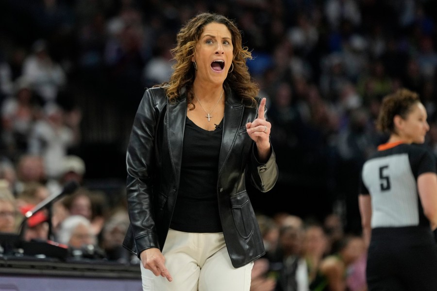 Connecticut Sun head coach Stephanie White reacts after a foul called on the Sun during the first half of Game 5 of a WNBA basketball semifinals against the Minnesota Lynx, Tuesday, Oct. 8, 2024, in Minneapolis. (AP Photo/Abbie Parr)