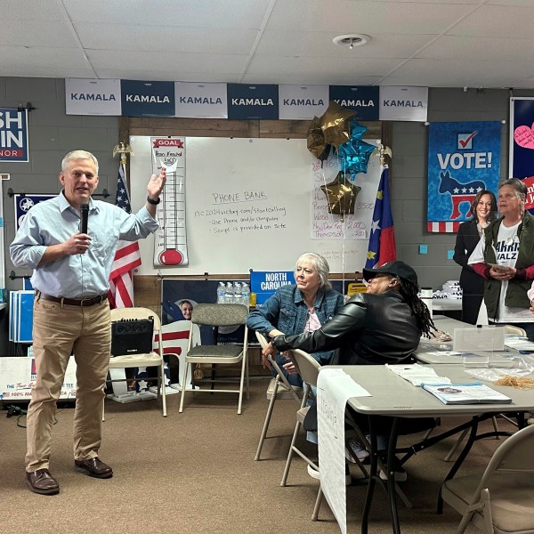 North Carolina Democratic gubernatorial nominee and state Attorney General Josh Stein, left, speaks to Johnston County Democratic Party volunteers Tuesday, Oct. 29, 2024, in Smithfield, N.C. (AP Photo/Gary D. Robertson)